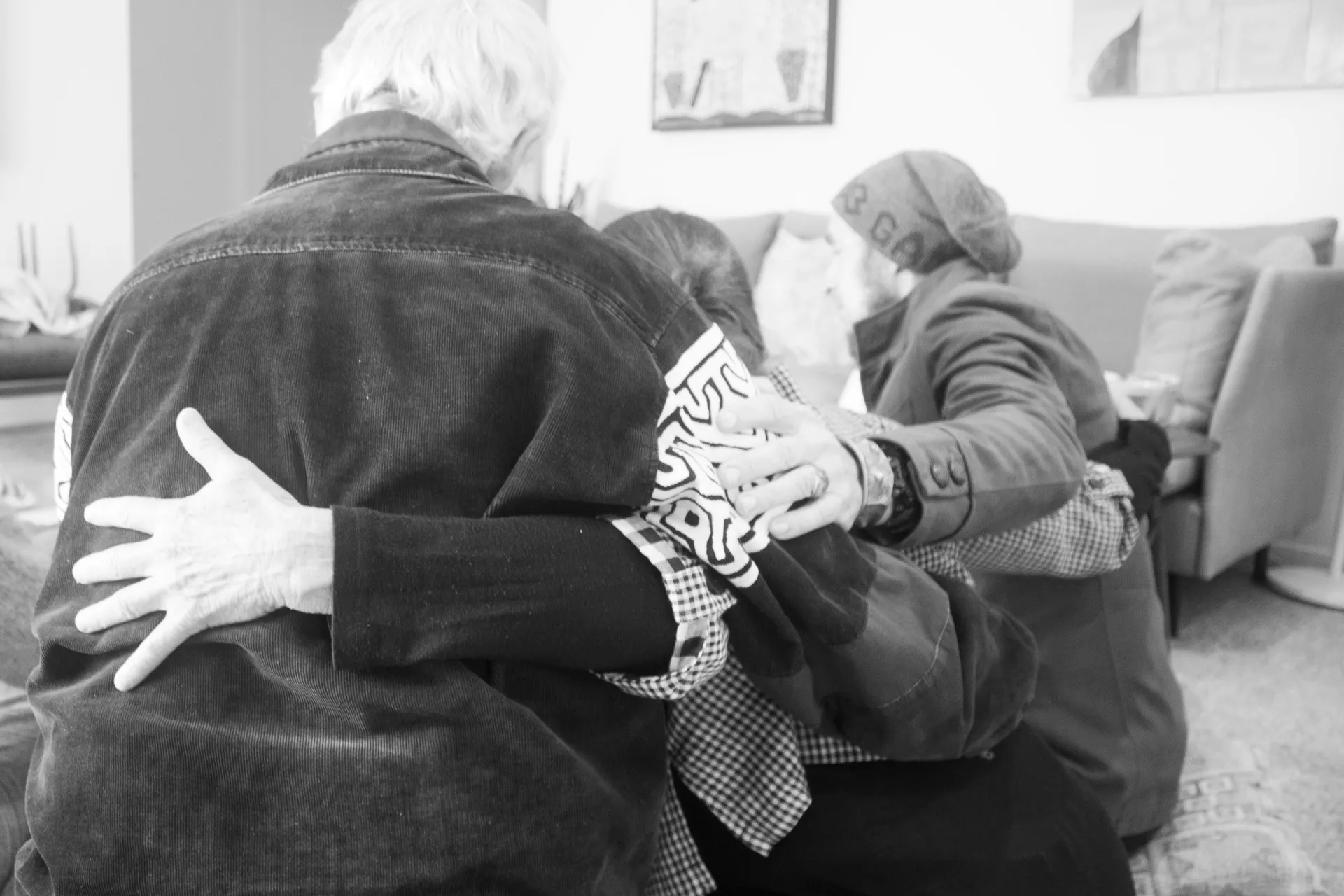 Empathy practitioners with their arms around each other feeling supported