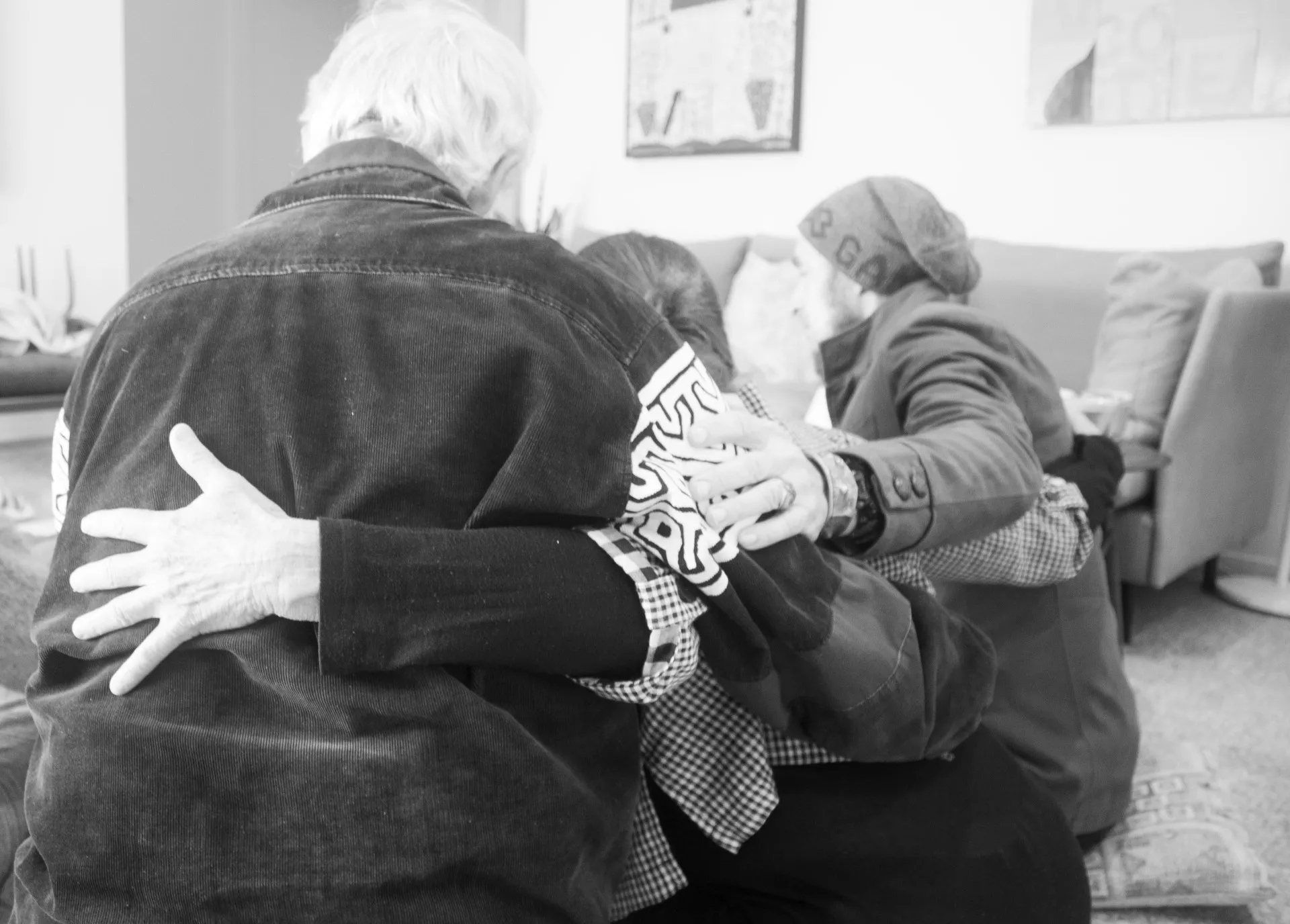 Empathy practitioners with their arms around each other feeling supported